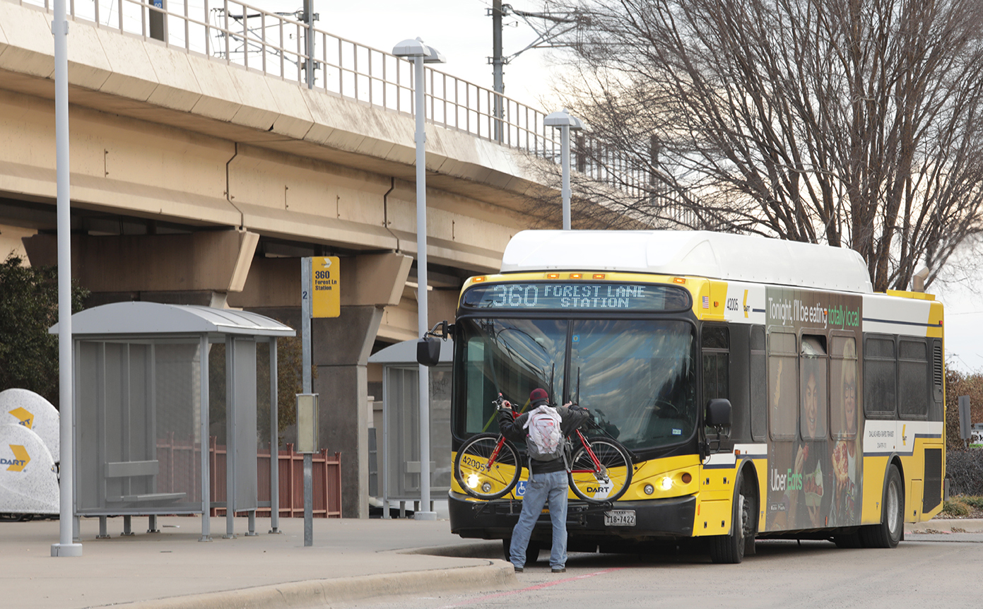 DART rider loading bike on bus