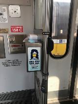 Mask dispenser on DART light rail vehicle.